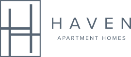 A green poster with the words "HAVEN Apartment Homes" written on it.