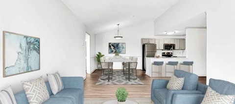 A living room with a dining area in the background.