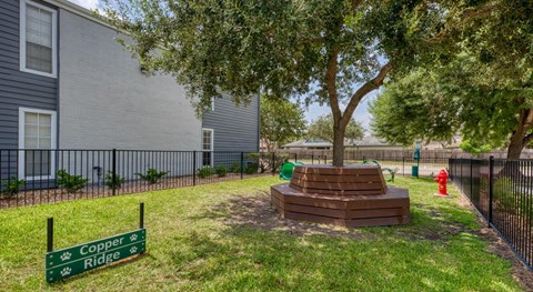 A sign in front of a building says "Cooper Ridge.".