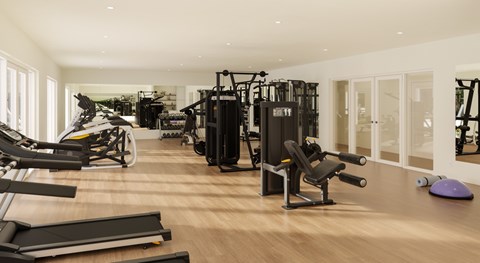 A gym with a variety of equipment including treadmills, weights, and exercise machines.