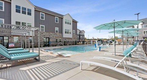 A sunny day at the pool with sun loungers and umbrellas.