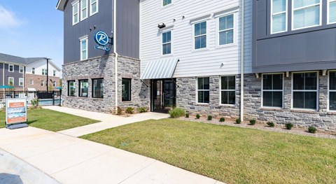A building with a blue sign on the front.