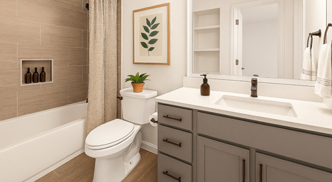 A bathroom with a white toilet, a white sink, and a white bathtub.