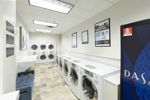 A row of washing machines in a laundromat.