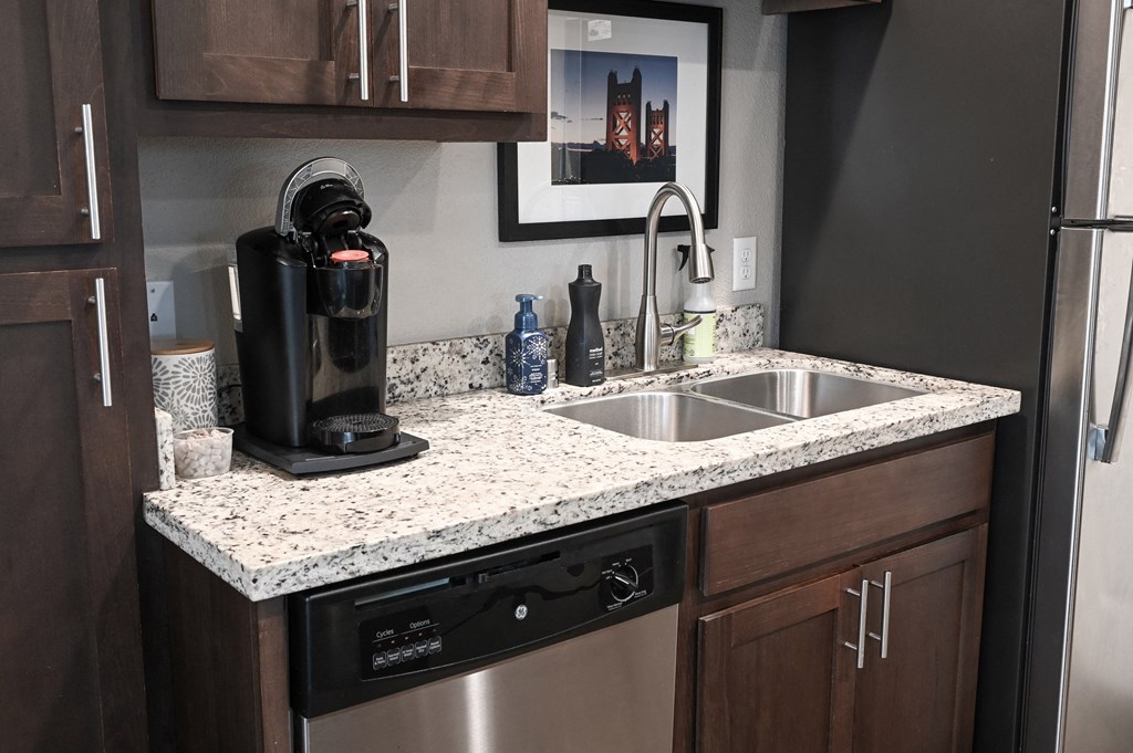 a kitchen with a sink and a dishwasher