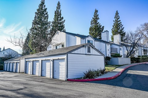 a row of garages in front of a house