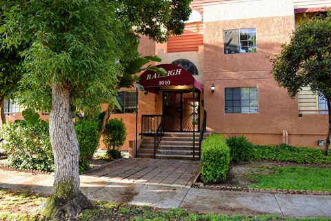 A building with a red sign that says "Raleigh" on it.