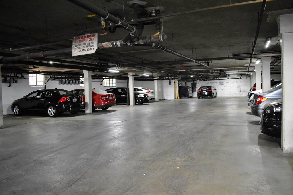 a parking garage with cars parked in it