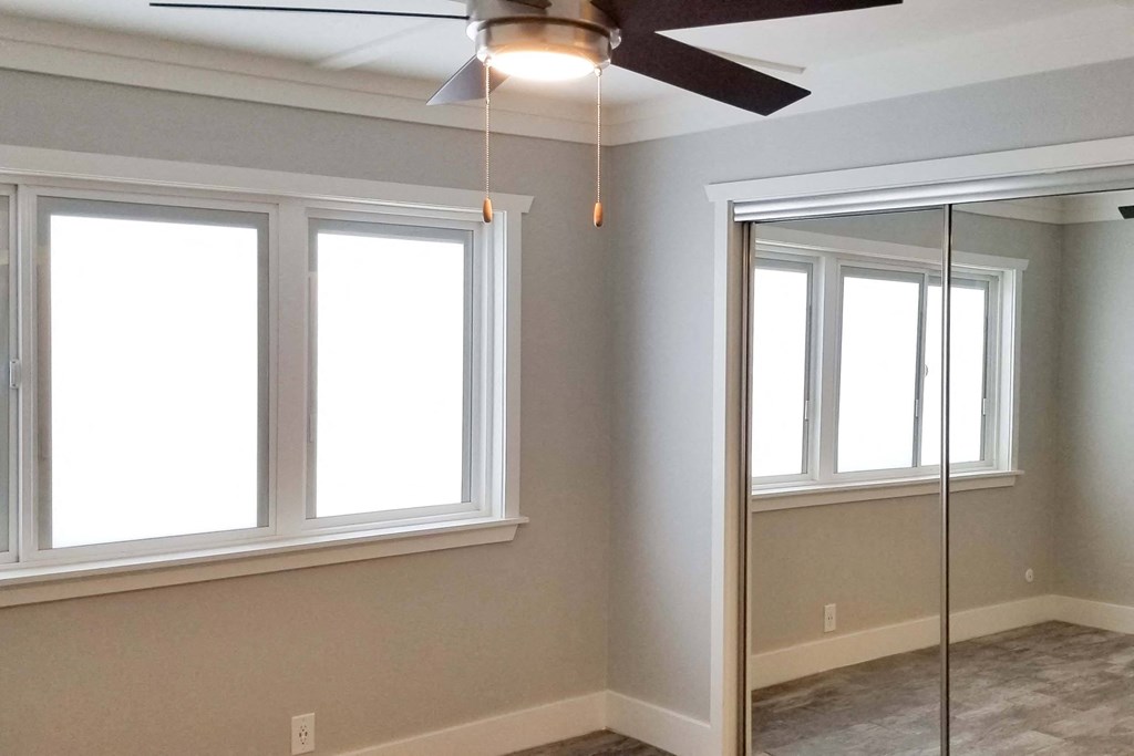 a living room with a ceiling fan
