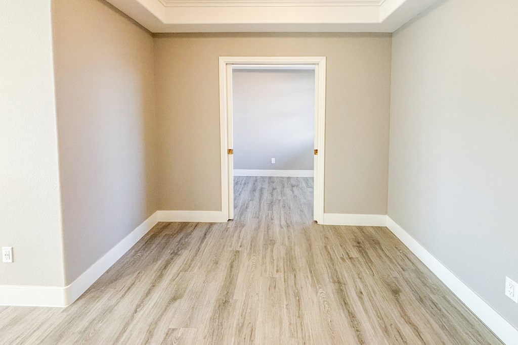 A room with a doorway leading to another room.