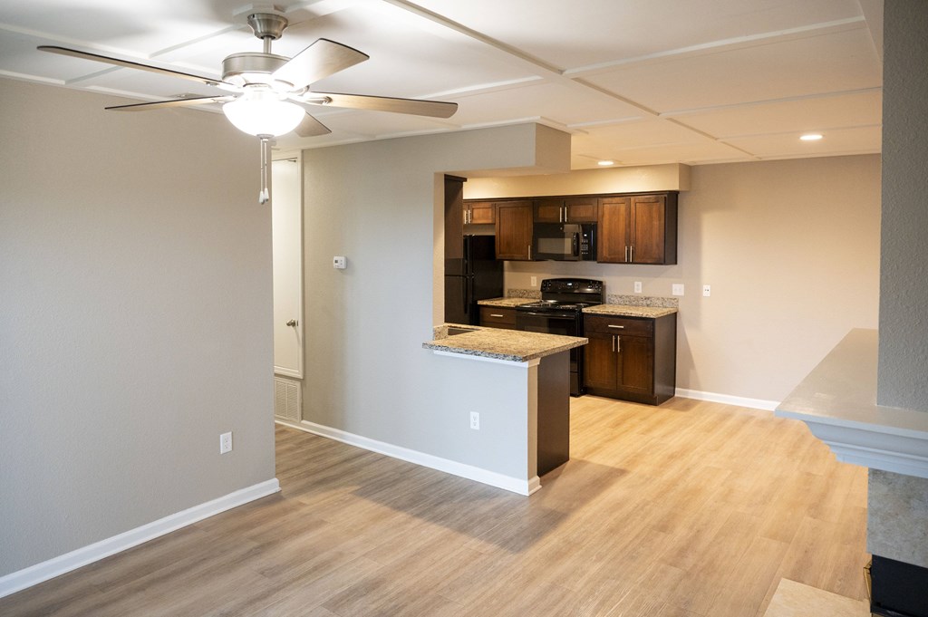 A kitchen area with a fan and wooden flooring at Sierra Oaks Living Apartments, Cameron Park, CA 95682