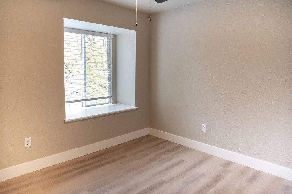 A room with a window and a ceiling fan at Sierra Oaks Living Apartments, Cameron Park, CA 95682