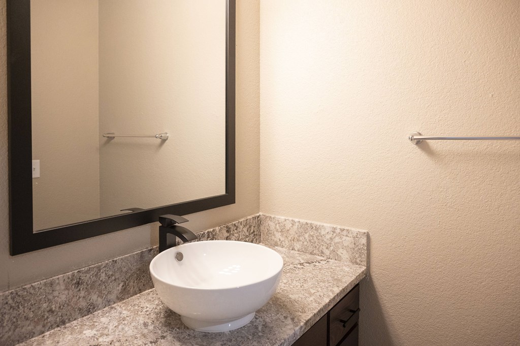 A bathroom sink with a mirror above it at Sierra Oaks Living Apartments, Cameron Park 95682