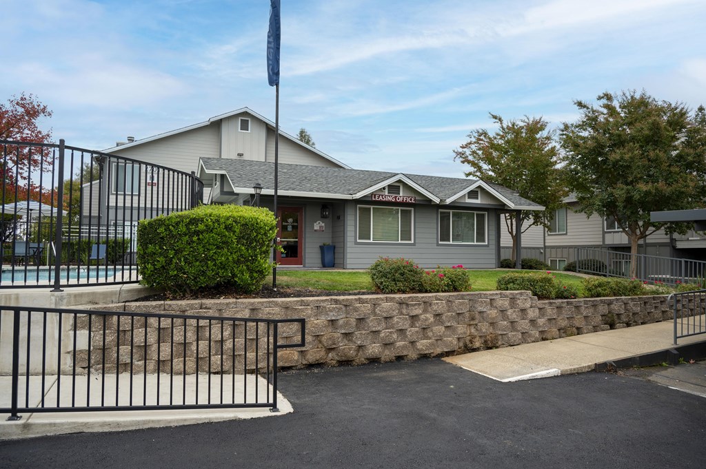 A house with a flag on top of it at Sierra Oaks Living Apartments, Cameron Park, California