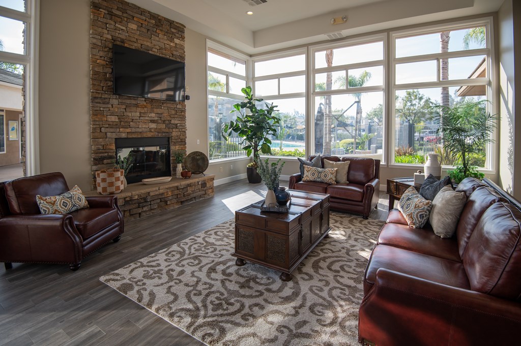 A living room with a fireplace and a television.