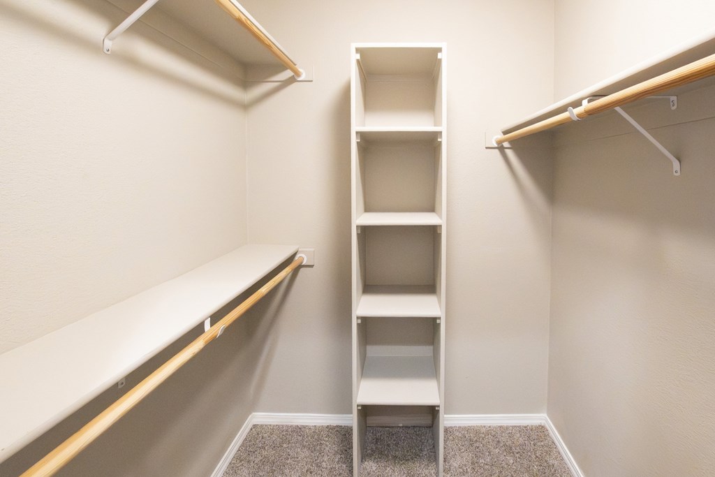 A small room with a shelf and a bench.