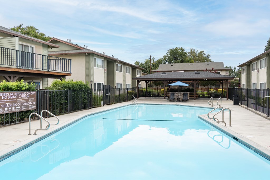 A pool with a sign that says "NO DIVING CAPTION".