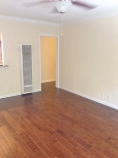 bedroom with wood look flooring and veiling fan