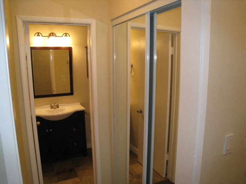 Large closet with mirrored doors