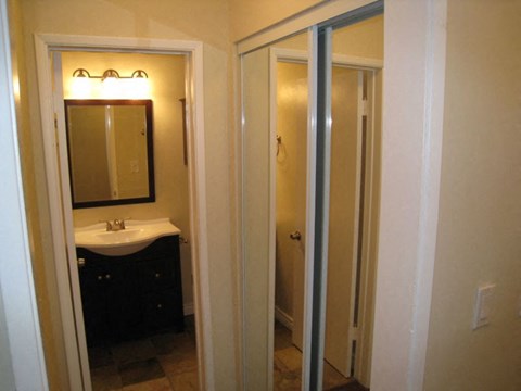 Large closet with mirrored doors