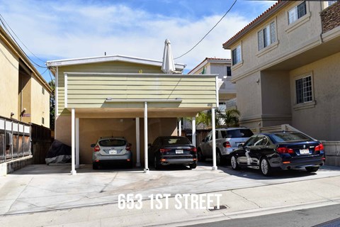 a car garage with cars parked in it