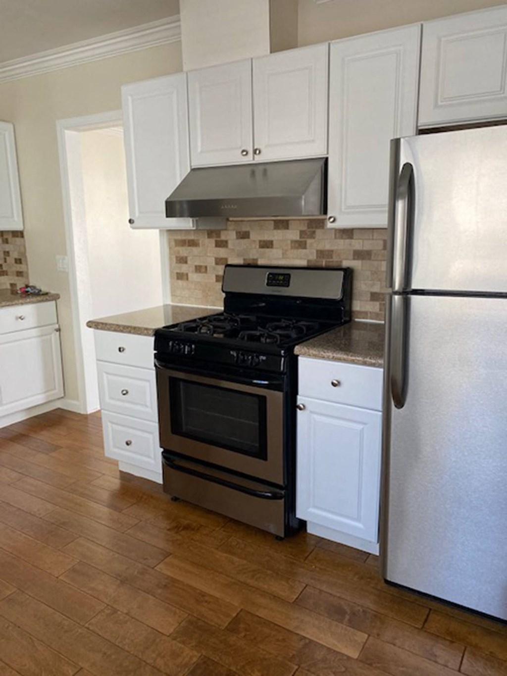 kitchen with appliances and tile backsplash