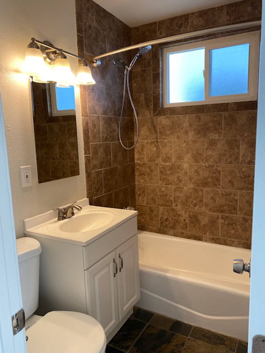 bathroom with tile shower