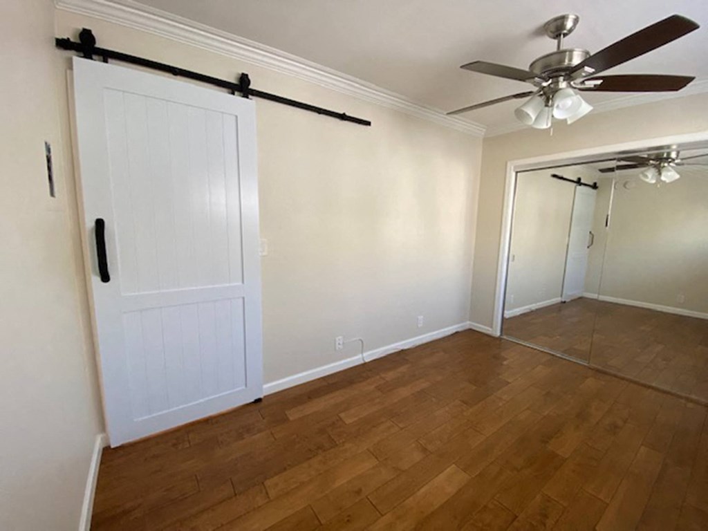 Bedroom with wood floors