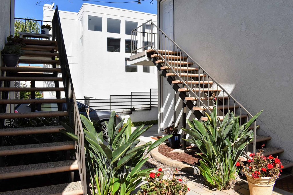 walkway between units with colorful foliage
