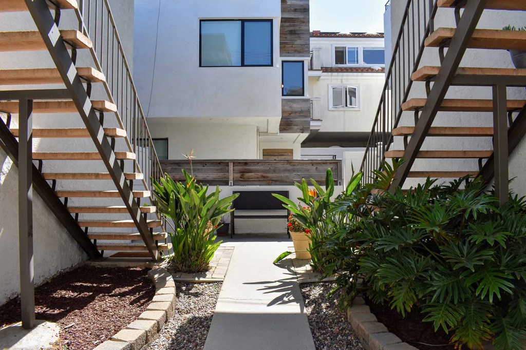 walkway between units with colorful foliage