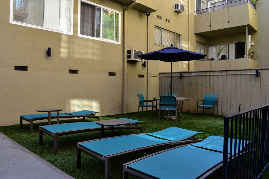 View of gated community pool lounge and seating area