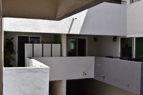 a view of the balconies of a white house