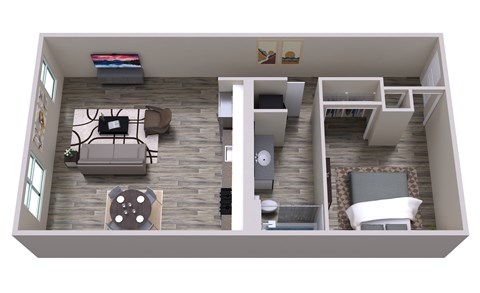 A top down view of a living room with a grey couch and a grey rug.
