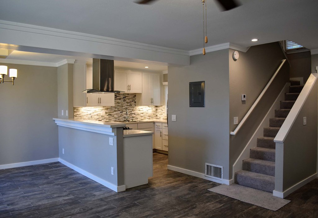 View from living area upstairs and also into kitchen