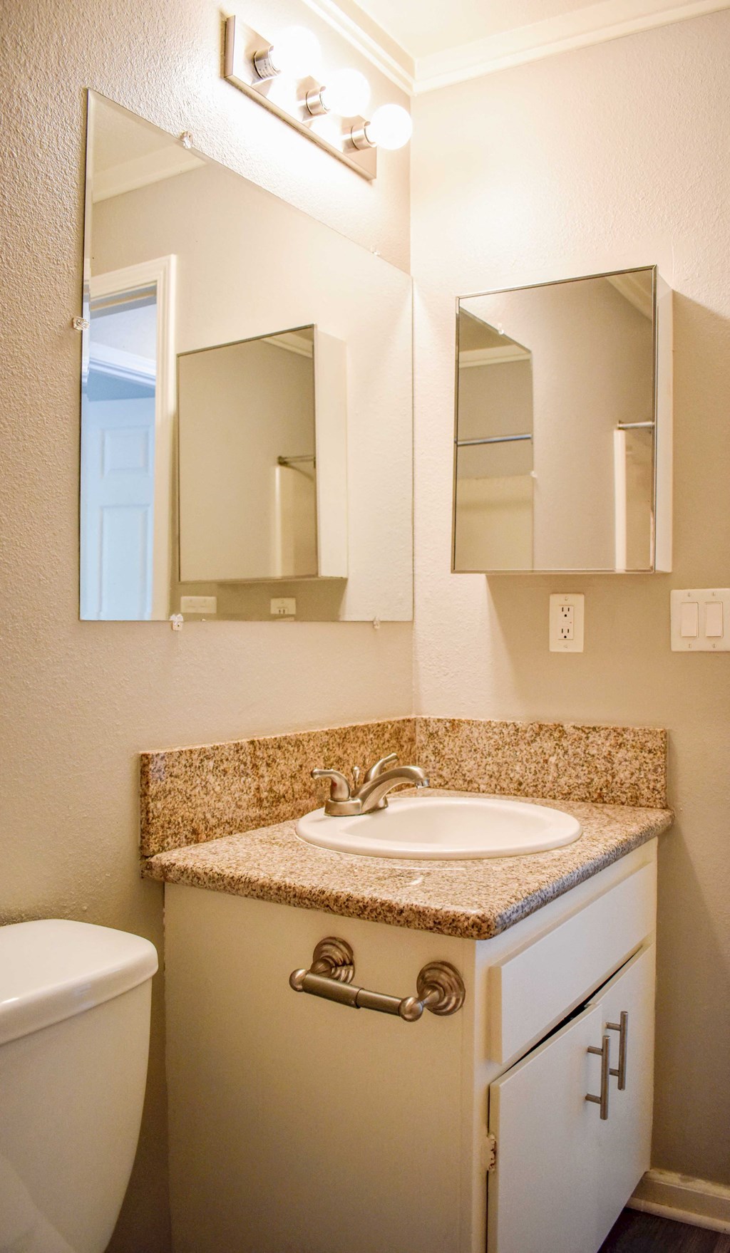 View of bathroom with vanity and inlaid sink, mirror, medicine cabinet