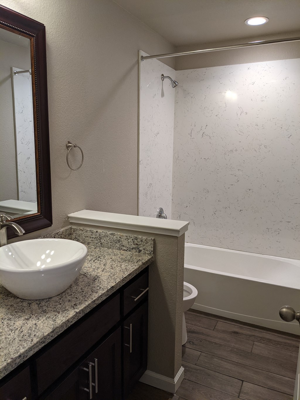 View of bathroom vanity with surface mounted bowl sink