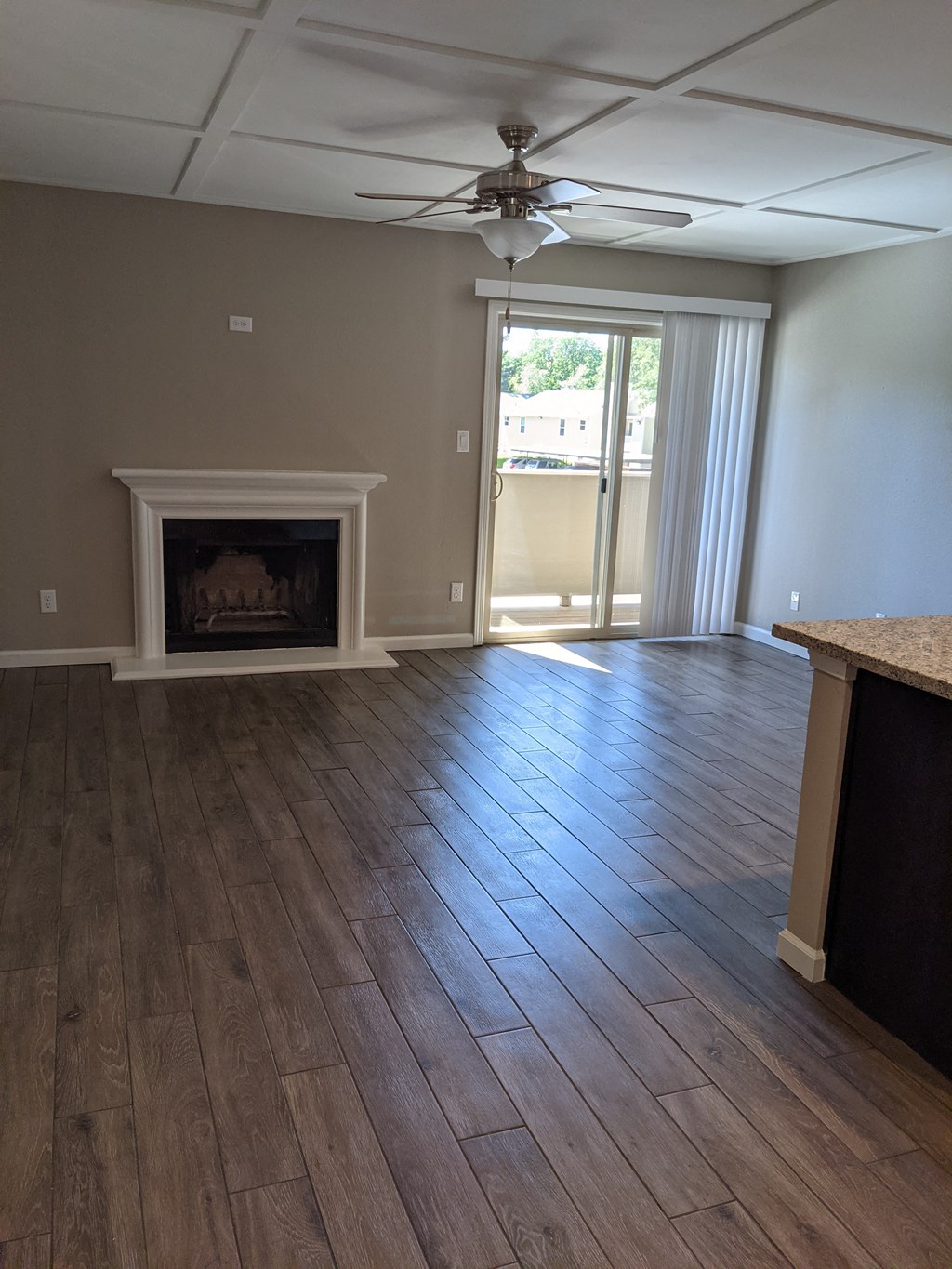 View of living room with wood floors and fire place