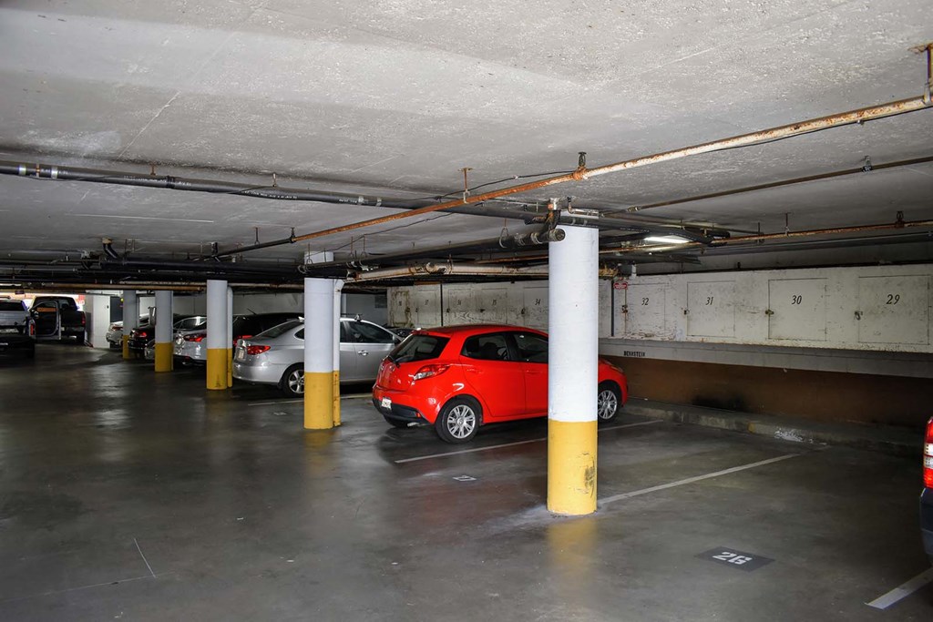 a parking garage with cars in it