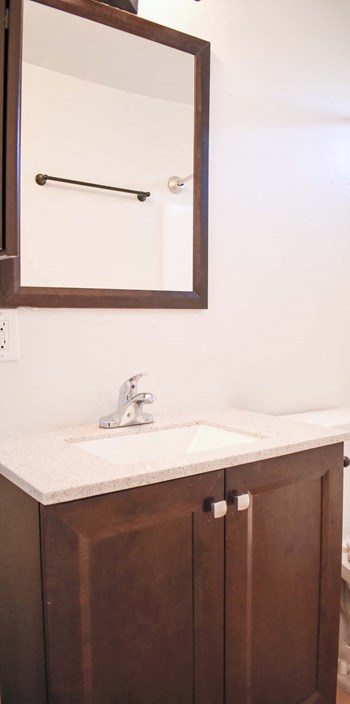 bathroom sink with matching over sink mirror