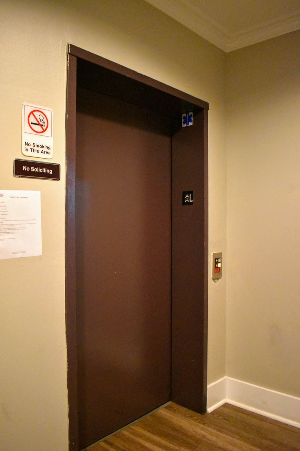 a door to a room with a no smoking sign on it