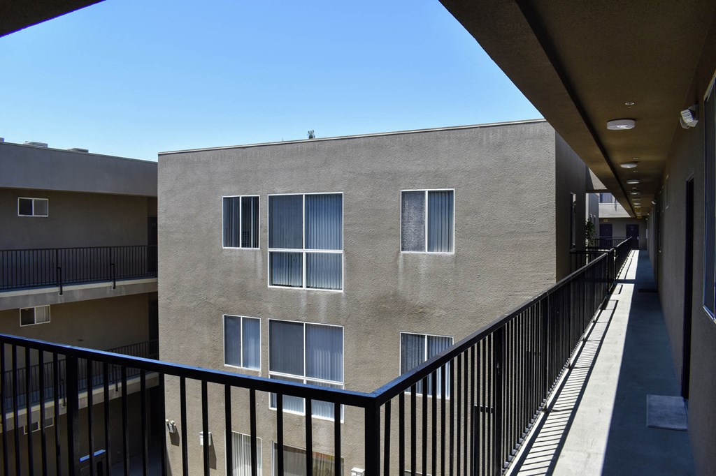the view of a building from a balcony