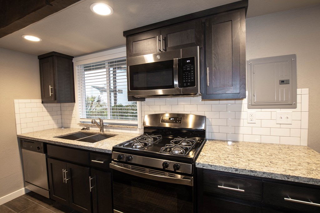 Kitchen with granite counters and stainless appliances and double sink