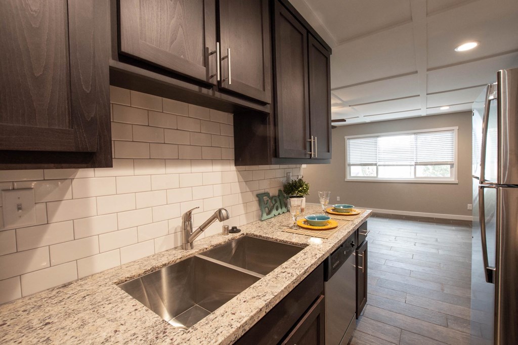 Kitchen with granite counters and stainless appliance