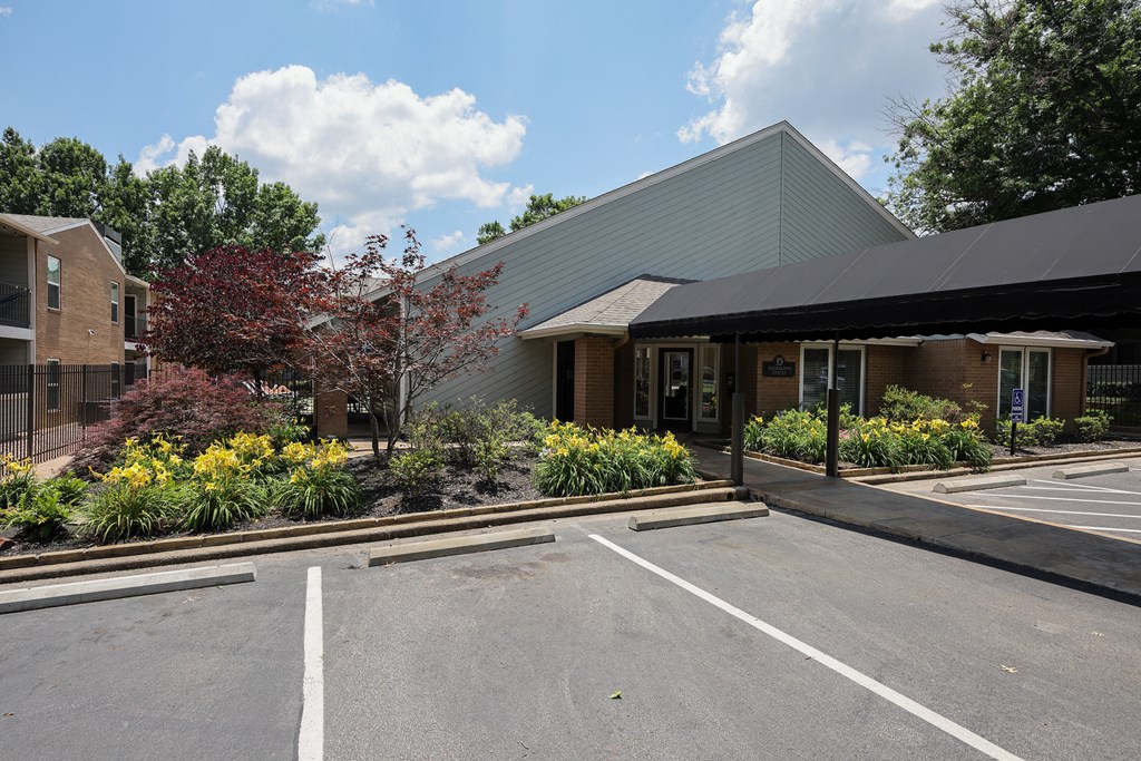 View of main Deerwood leasing office surrounded by lush shrubbery