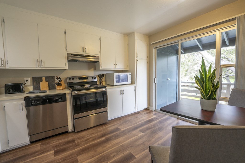 a kitchen and dining area in a 555 waverly unit