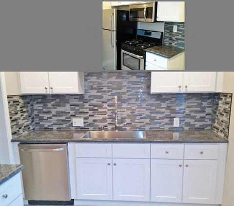 a kitchen with white cabinets and a counter top