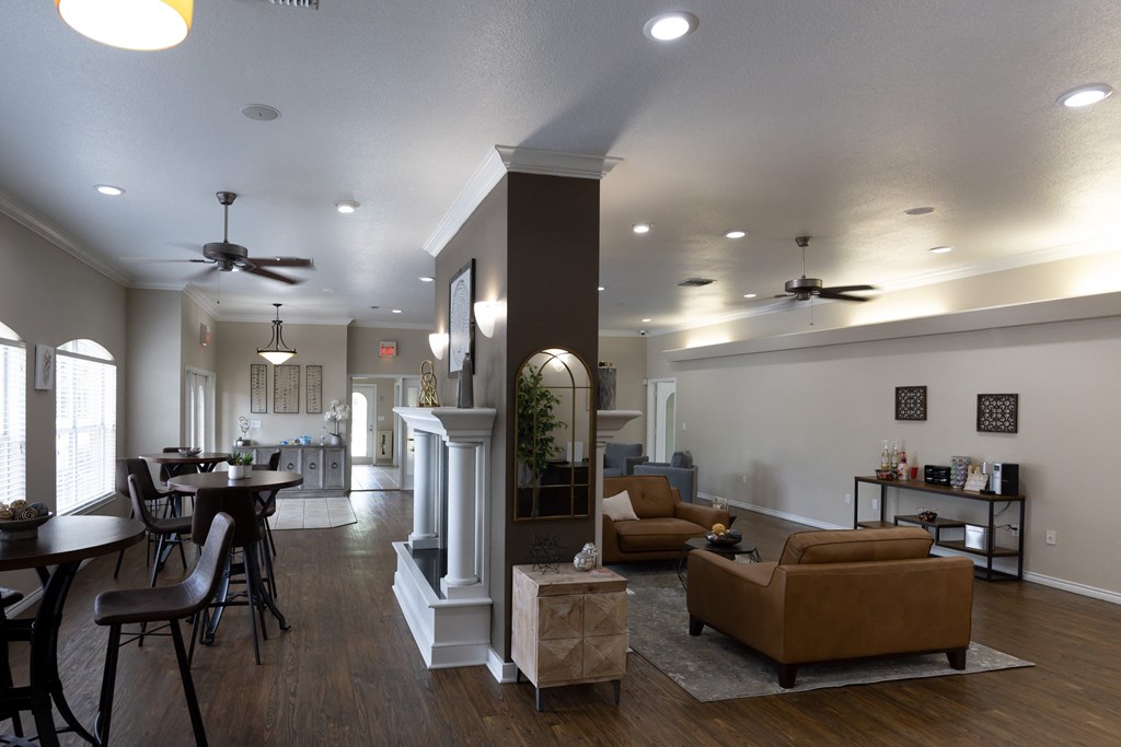 View of clubroom with seating, well decorated, and coffee bar.