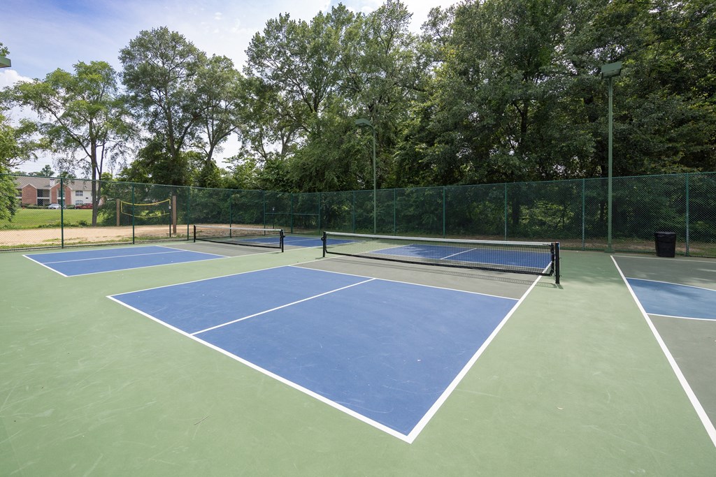 View of pickle ball court with sand volleyball court in back ground