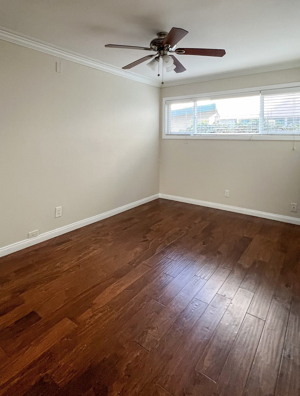 bedroom with wood floors and ceiling fan