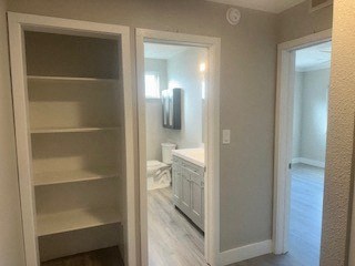 A white bathroom with a walk in shower.